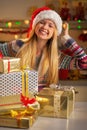 Teenager with stack of christmas present boxes Royalty Free Stock Photo