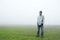 Teenager standing in field Royalty Free Stock Photo