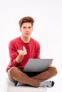 Teenager student working at laptop on white background Royalty Free Stock Photo