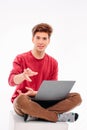 Teenager student working at laptop on white background Royalty Free Stock Photo