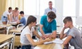 Teenager students performing group tasks