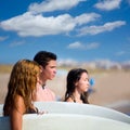 Teenager surfers group happy in beach shore