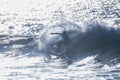 Teenager surfing at the wave in tenerife playa de las americas - white wetsuits and beautiful and perfect wave