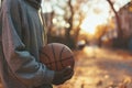 Teenager sweatshirt holding basketball young guy man sport athlete game autumn street city outside competition