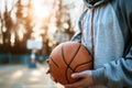 Teenager sweatshirt holding basketball young guy man sport athlete game autumn street city outside competition