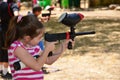 Teenager in a target practice with a paintball gun Royalty Free Stock Photo