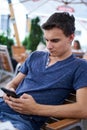 Teenager texting from his mobile phone Royalty Free Stock Photo