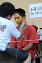 Teenager with tiger face painting