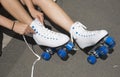 Teenager tying laces on a pair of roller skates