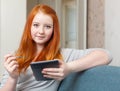 Teenager uses tablet computer Royalty Free Stock Photo