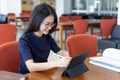 Teenager using digital tablet in classroom