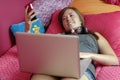 Teenager using mobile phone and computer Royalty Free Stock Photo