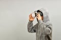 A teenager in a VR helmet is surprised by the immeasurable reality in the virtual world Royalty Free Stock Photo