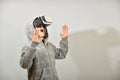 A teenager in a VR helmet is surprised by the immeasurable reality in the virtual world Royalty Free Stock Photo