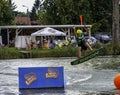 Teenager wakeboarding on a lake - Brwinow, Masovia, Poland