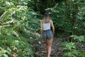 Teenager walking away into New Zealand bush