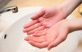 Washing hands in the bathroom sink. Frequent hand washing is a prerequisite for good hygiene in the face of the