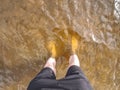 Teenager in water. Blond hair boy go swimming in the pond