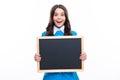 Teenager younf school girl holding school empty blackboard isolated on white background. Portrait of a teen female
