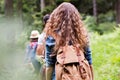 Teenagers with backpacks hiking in forest. Summer vacation. Royalty Free Stock Photo