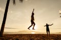 Teenagers balance on slackline silhouette Royalty Free Stock Photo