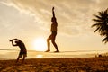 Teenagers balance on slackline silhouette Royalty Free Stock Photo