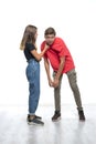 Teenagers, boy and girl, sort things out in a joking manner