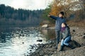 Teenagers couple meet on the bank of the river.