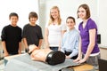 Teenagers with CPR Training Mannequin