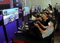 Teenagers enjoy play e-racing simulator in Bangkok International Motor Show