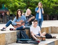 Teenagers friends playing musical instruments Royalty Free Stock Photo