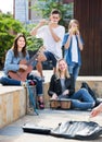 Teenagers friends playing musical instruments Royalty Free Stock Photo