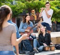 Teenagers friends playing musical instruments Royalty Free Stock Photo