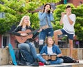 Teenagers friends playing musical instruments Royalty Free Stock Photo