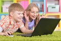 teenagers in front of modern laptop