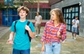 Teenagers going home after school and talking Royalty Free Stock Photo