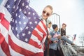 Teenagers group having fun and waving american flags at sunset Royalty Free Stock Photo