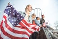 Teenagers group having fun and waving american flags at sunset Royalty Free Stock Photo