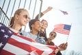Teenagers group having fun and waving american flags at sunset Royalty Free Stock Photo