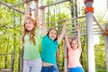 Teenagers hanging on the brachiating bar together Royalty Free Stock Photo