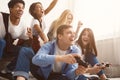 Teenagers having fun, playing video games online