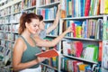 Teenagers holding book and reading new literature Royalty Free Stock Photo