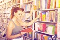 Teenagers holding book and reading new literature Royalty Free Stock Photo