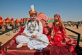 Teenagers in Indian folk costumes sitting Royalty Free Stock Photo