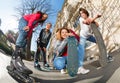 Teenagers with inline skates and skateboards