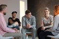 Teenagers laughing during a group counseling session for youth Royalty Free Stock Photo