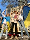 teenagers look at sky eyes covered eyes from sun with hands on shoulders flag Victory of Ukraine invincibility parachute Royalty Free Stock Photo