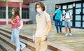 Teenagers in masks going home after school Royalty Free Stock Photo