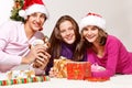 Teenagers packing Christmas gifts Royalty Free Stock Photo