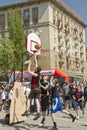 Teenagers play streetball on the open-air asphalt ground Royalty Free Stock Photo